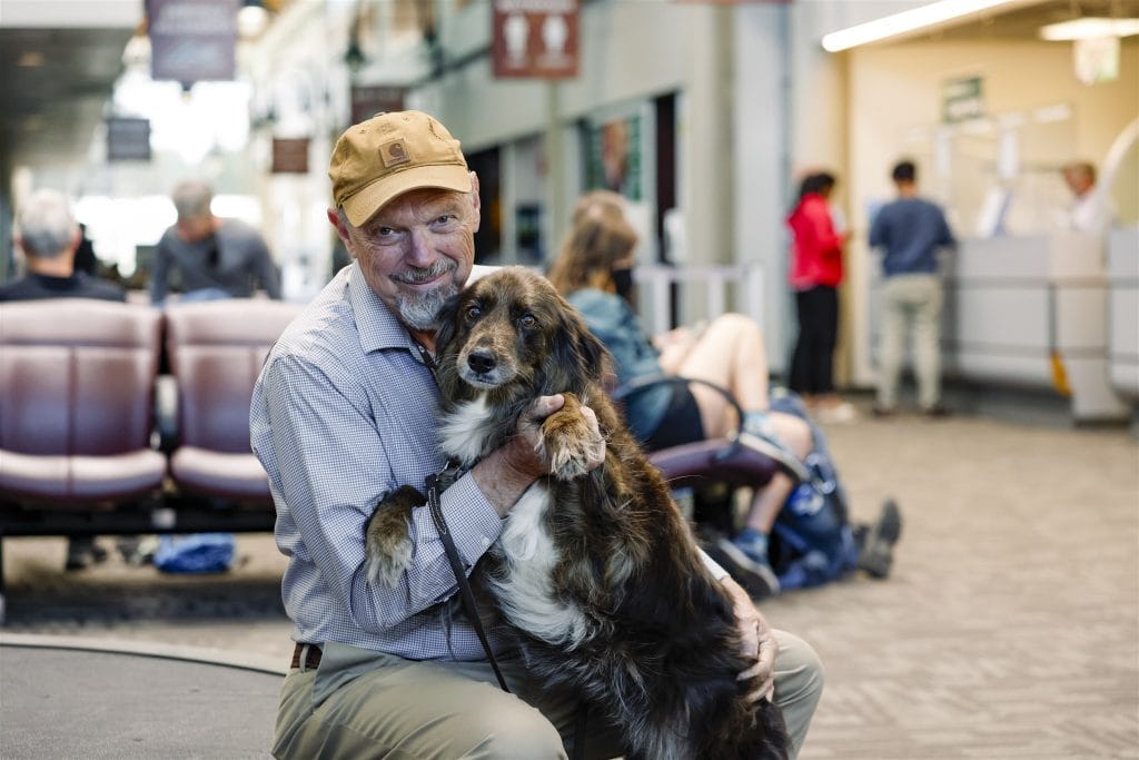 Man and dog in FLG airport terminal